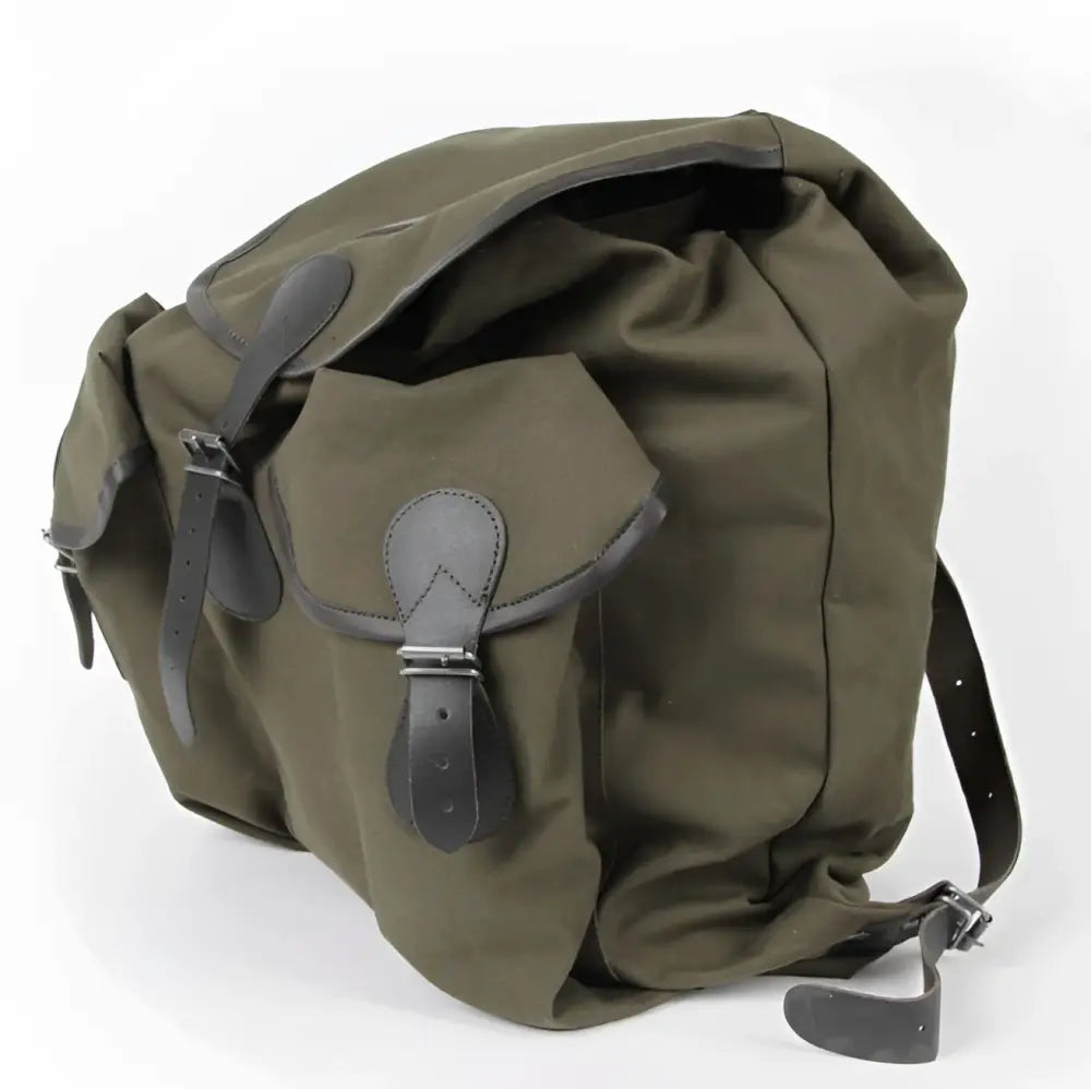 Olive green canvas backpack bear claw jätkän reppu with dark brown leather straps and buckles