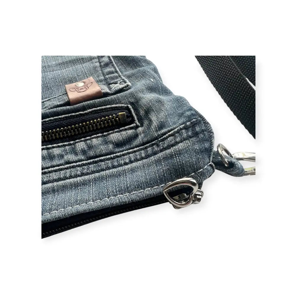 Denim crossbody bag farkkukassi kira with faded blue wash black zipper accents and silver-toned metal hardware