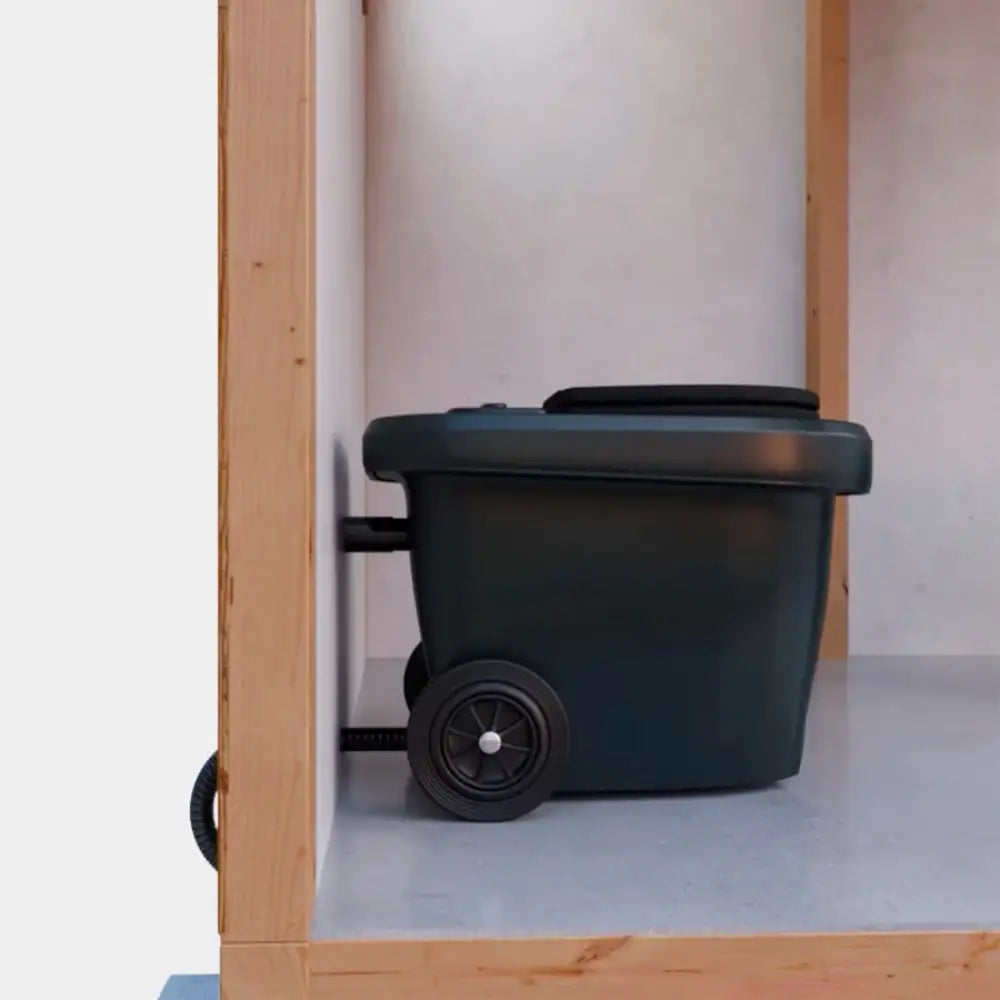 Dark green plastic storage bin with black wheels and lid for green toilet 100 easy kompostikäymälä