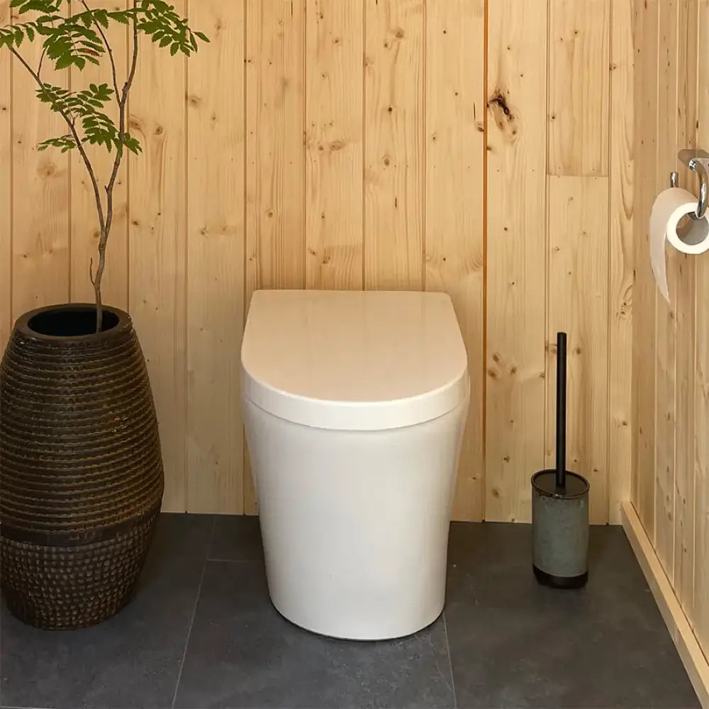 Moderni valkoinen keraaminen green toilet lux kuivakäymälä, pyöreä ja siro muotoilu