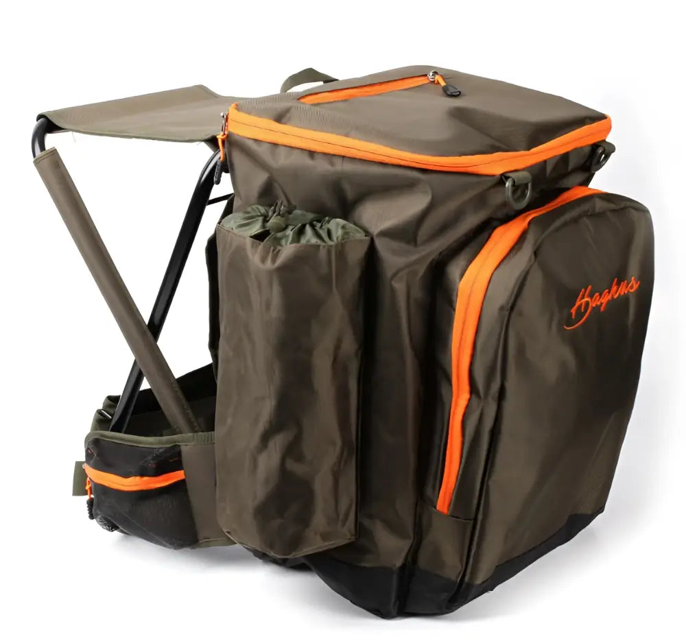 Olive green and orange haskins fishing backpack with integrated foldable stool for outdoor use