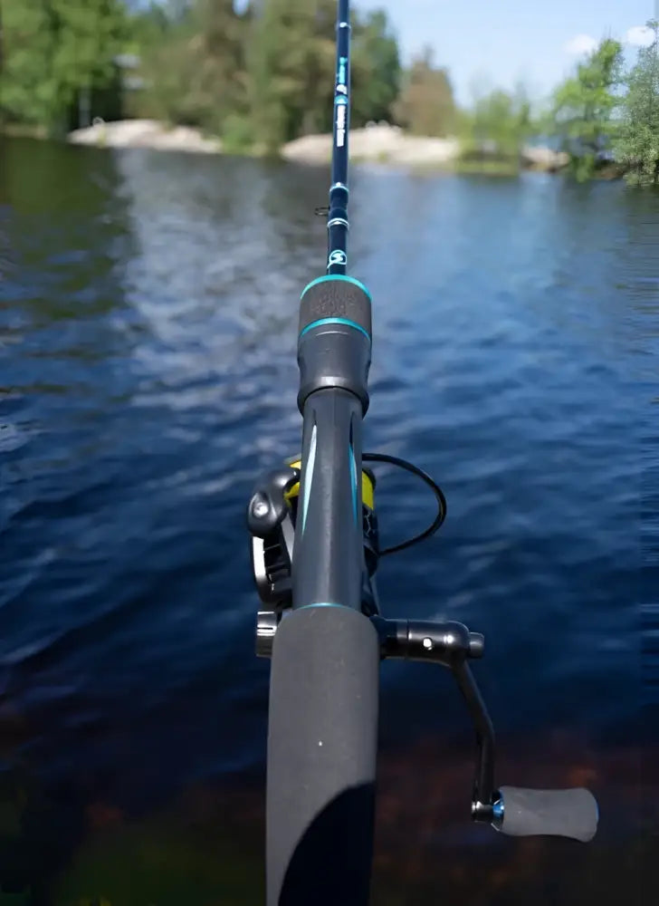 A sleek dark gray kalastajan kanava tirri micro fishing rod with teal accent and matching reel measuring 183cm 0.9-8.5g