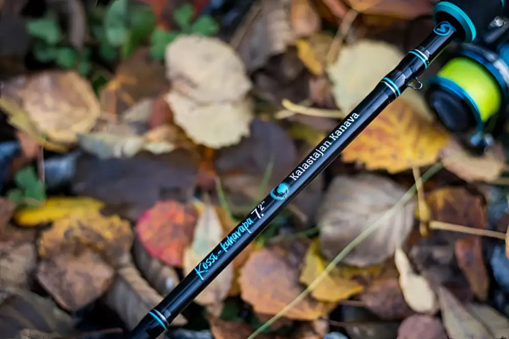 Black fishing rod kossi eukalyptus 7.2 by kalastajan kanava with teal accents and bright yellow reel fast 10-25g