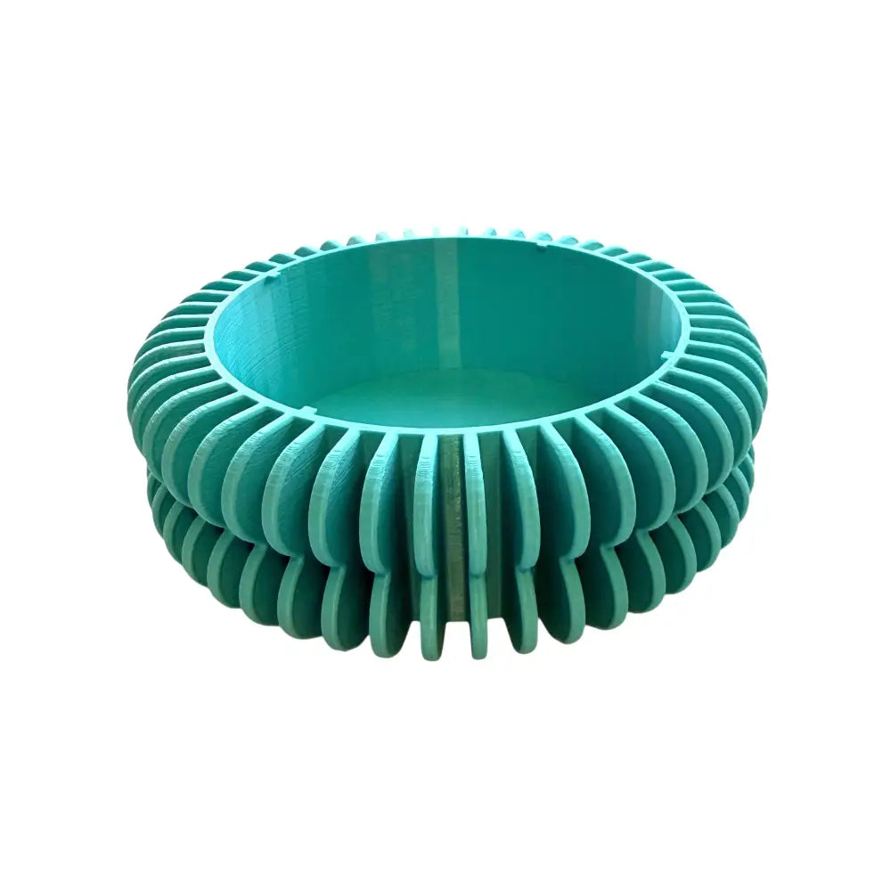 Teal värinen ribbattu muovinen kukkaruukun alunen pyöreällä kerroksellisella designilla