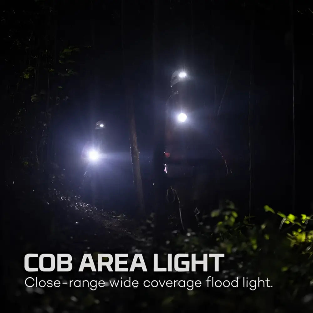 Bright white cob area light luxtreme sl 25 r mounted on helmet illuminating dark forest path up to 400 meters