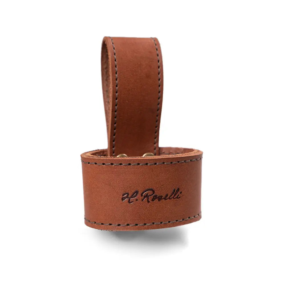 Brown leather roselli axe holster key ring with loop handle and embossed h shown from the back side