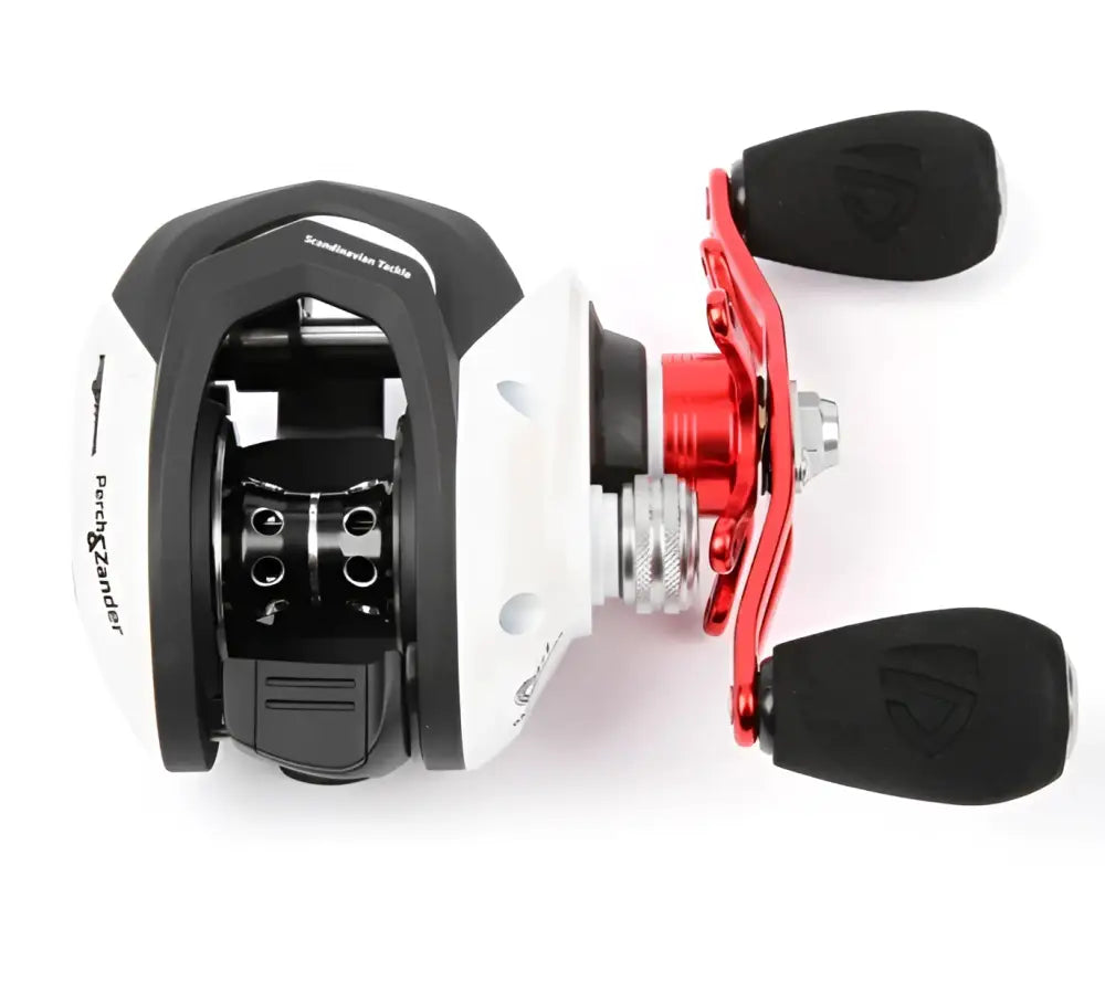 White and black Scandinavian Tackle perch and zander baitcasting fishing reel with red handle accents for hyrräkela use