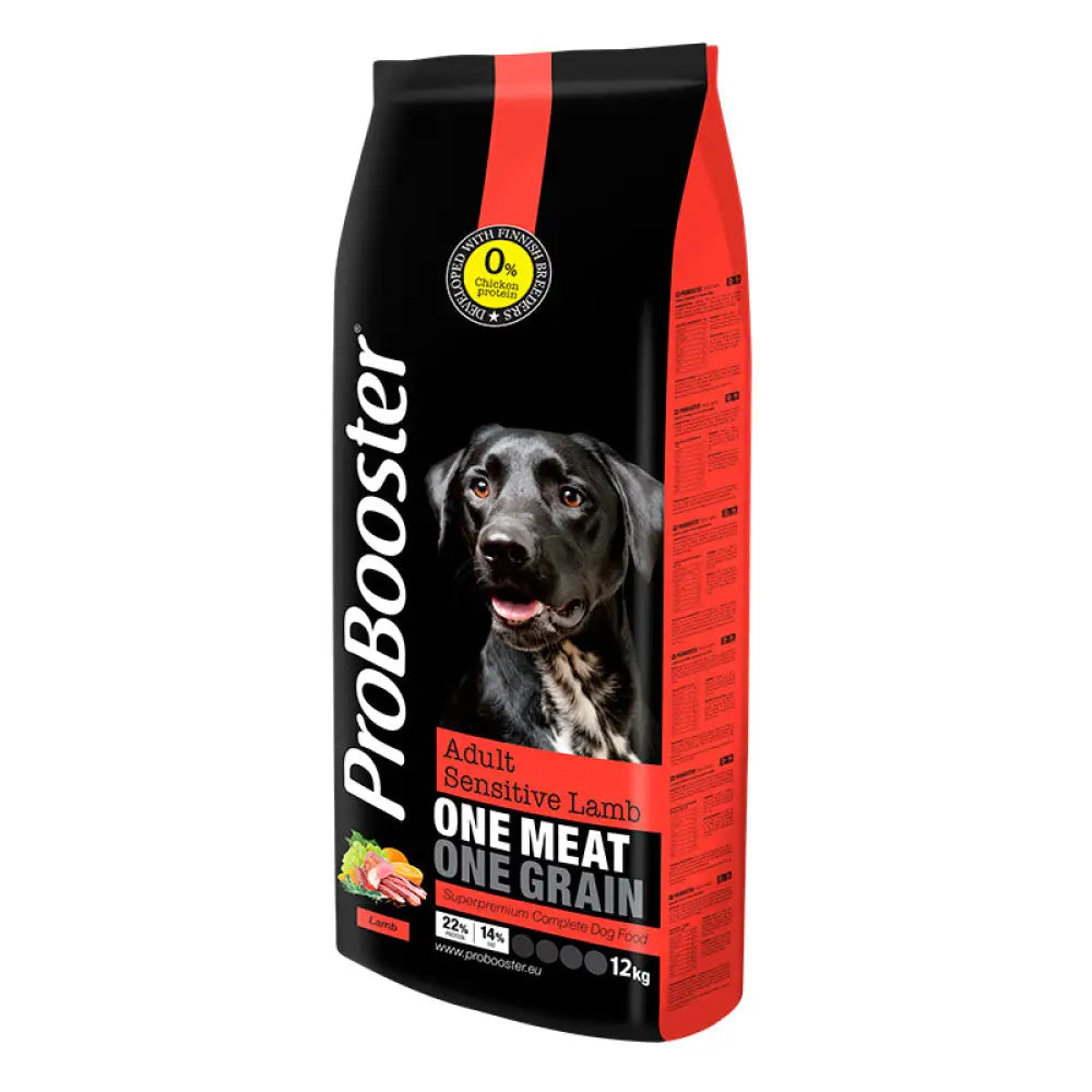 Black and red bag of probooster adult sensitive lamb one meat one grain dog food with a black labrador image