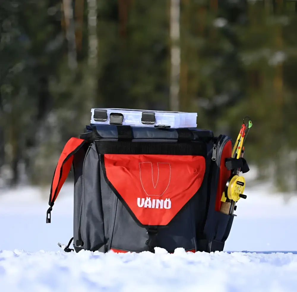Väinö kalajärvi 35 pilkkipönttöreppu red and black backpack with white cooler on top for ice fishing use