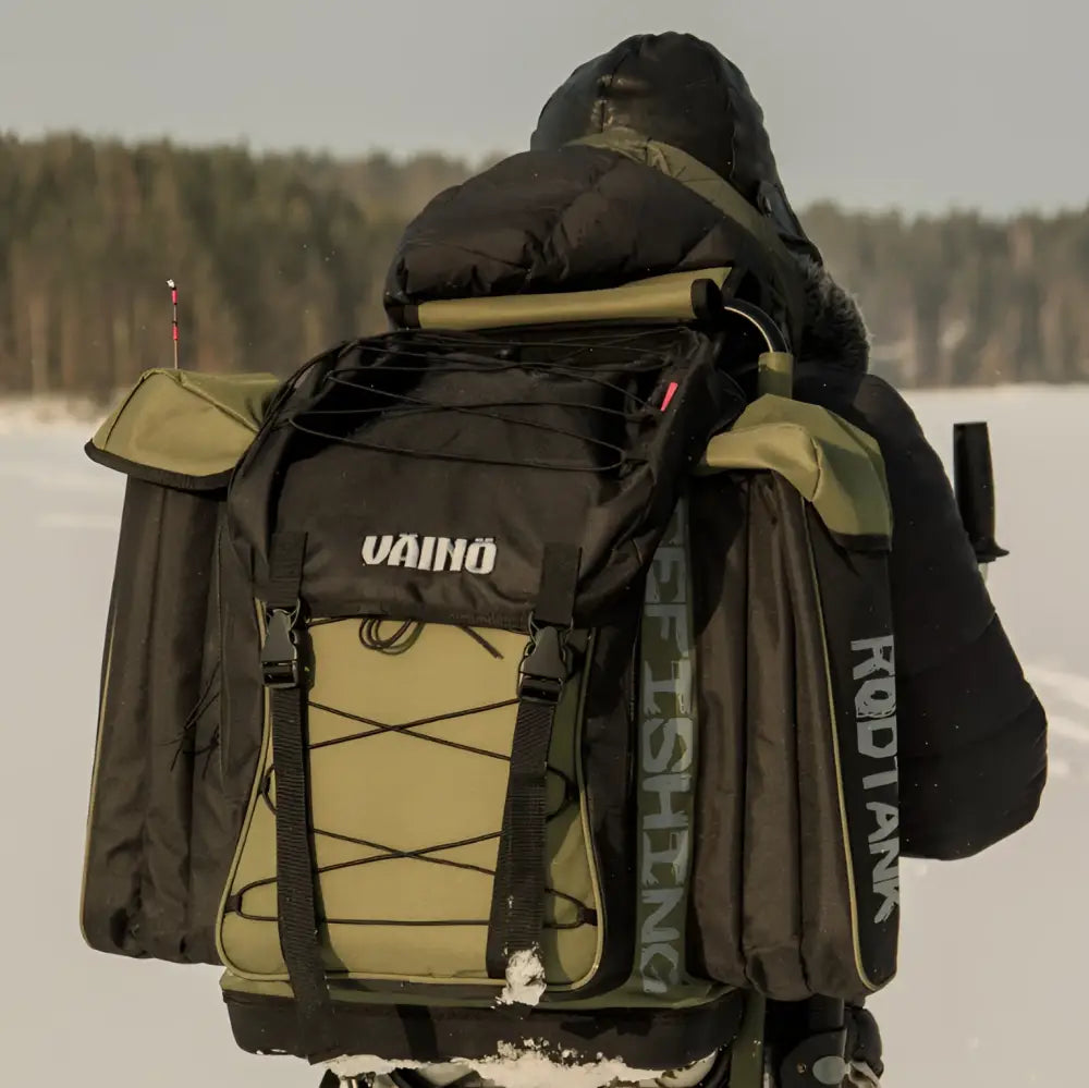 Black and olive green väinö tank 50l pilkkireppu with reinforced straps and side pockets for ice fishing use