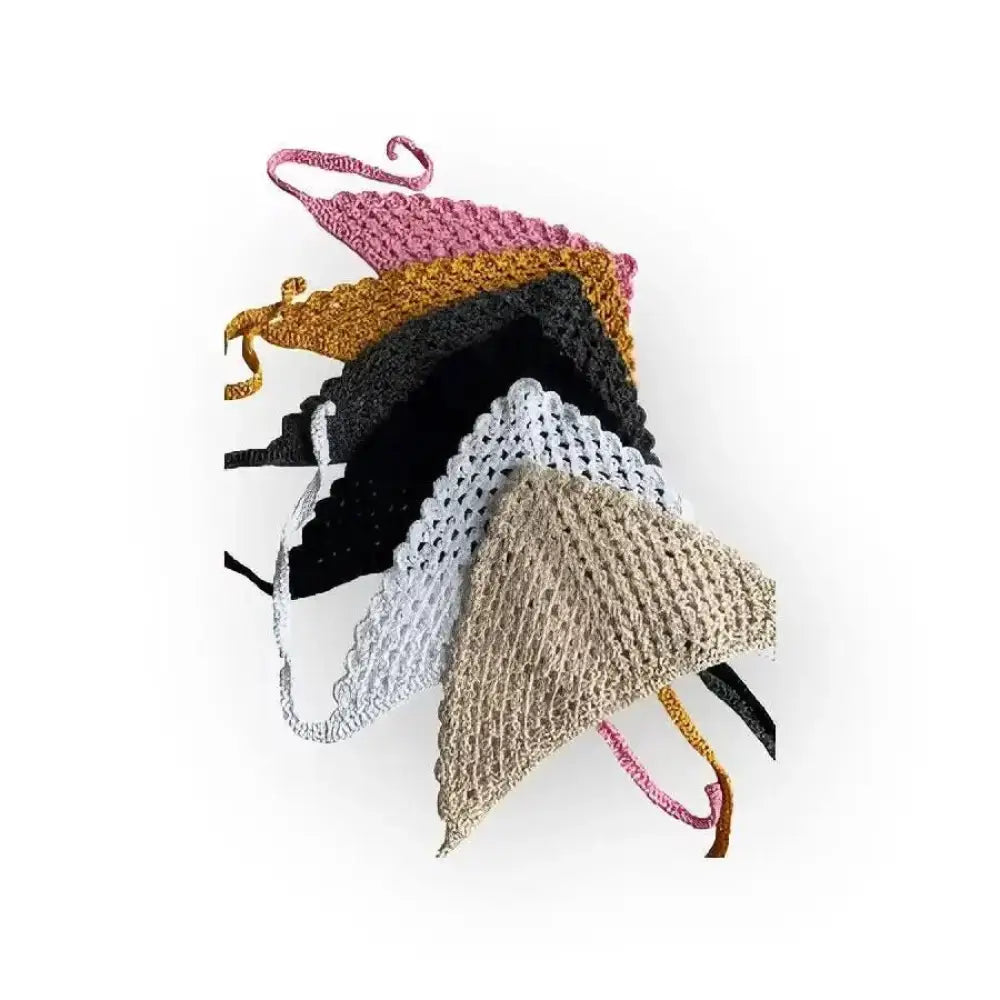 A collection of hand-crocheted virkattu hellehuivi triangle-shaped headbands in pink mustard yellow black white and beige