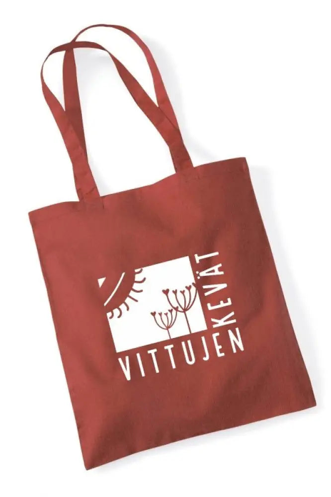 Punainen kangaskassi valkoisella vittujen kevät logolla ja graafisella painatuksella