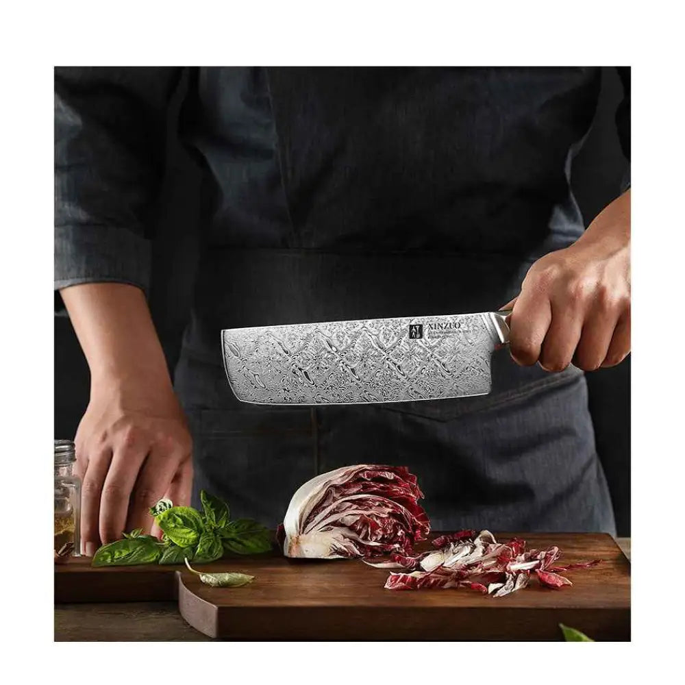 A sleek silver xinzuo jiang damascus 18 cm chef knife with a distinctive damascus pattern and ninjaw logo on the handle
